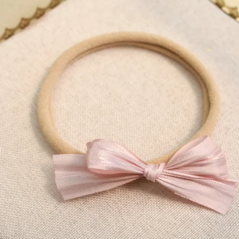 Babyhaarbandje - roze strik